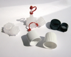 Moulded plastic caps, melamine, for square bottles series 310